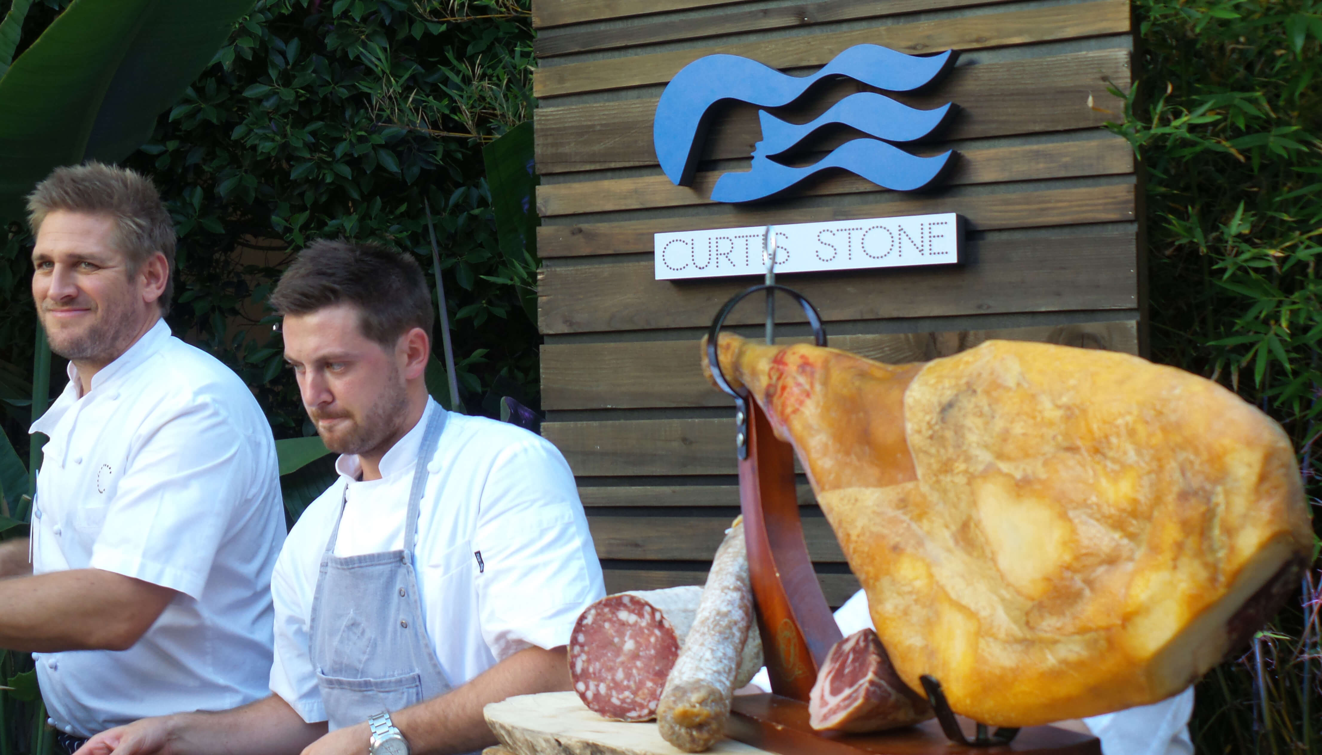 Chefs Curtis and Christian serve the charcuterie items. 