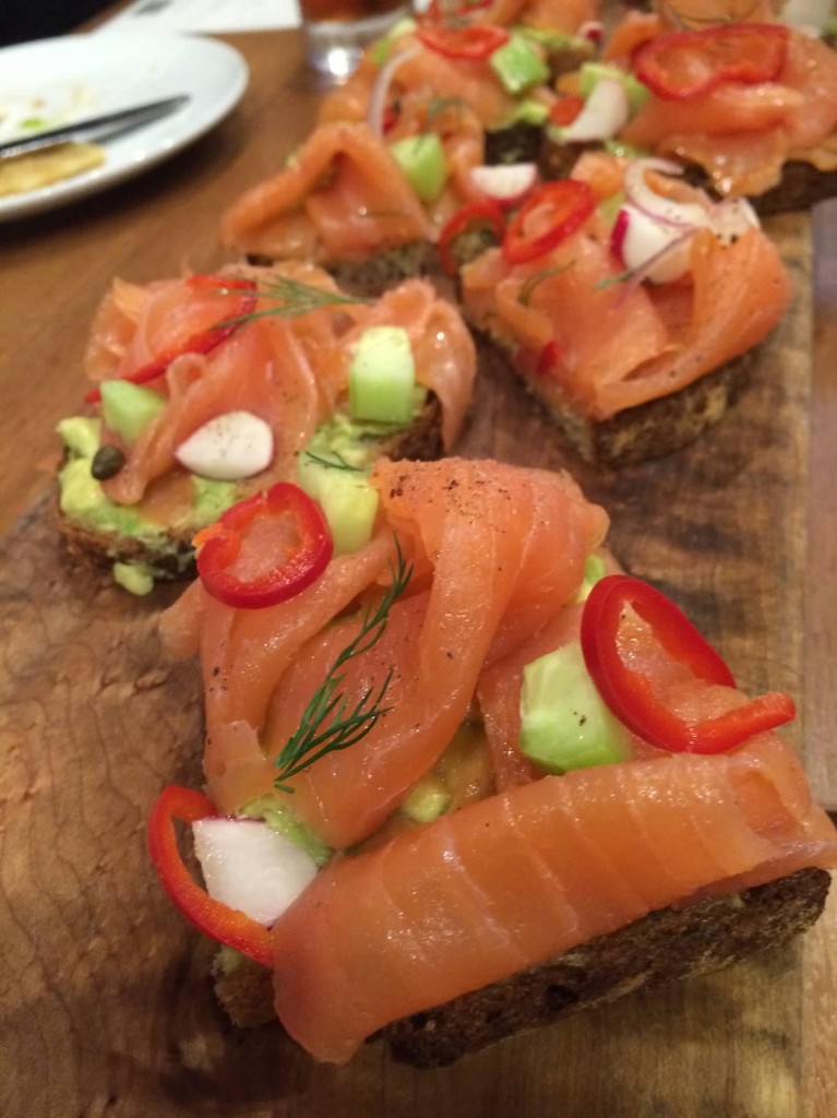 Smoked Salmon Tartine--avocado, lemon, capers, shaved onions, multigrain toast.