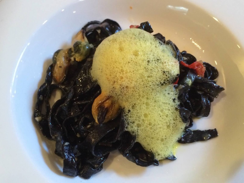 House-made squid ink pasta, mussels, piquillo peppers, saffron foam