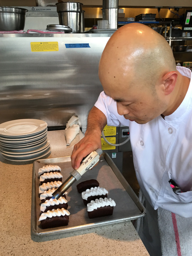 Chef Jason Park puts the finishing touches on dessert.