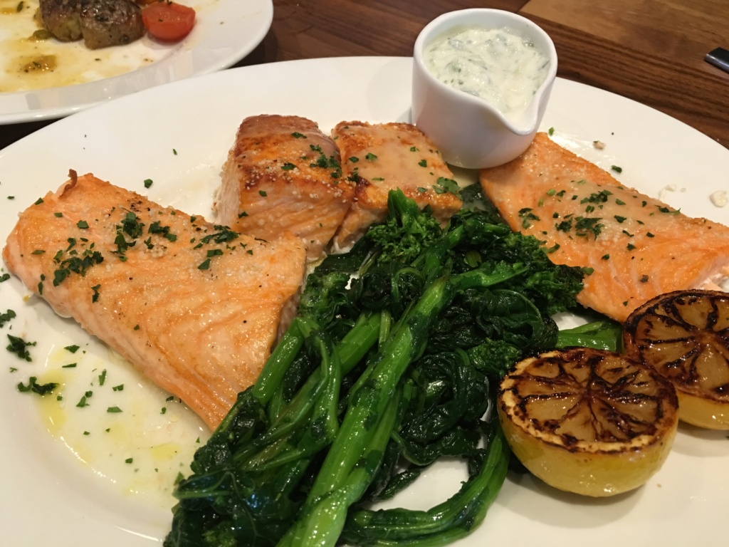 Applewood Grilled Faroe Island Salmon. Rice crust, sauteed rapini.